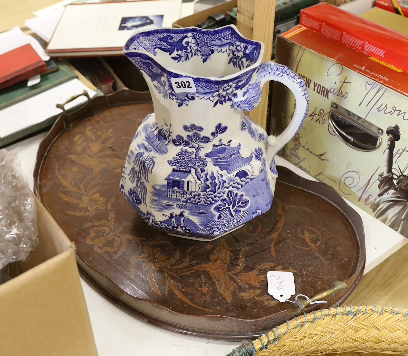 An inlaid kidney tray and a blue and white toilet jug